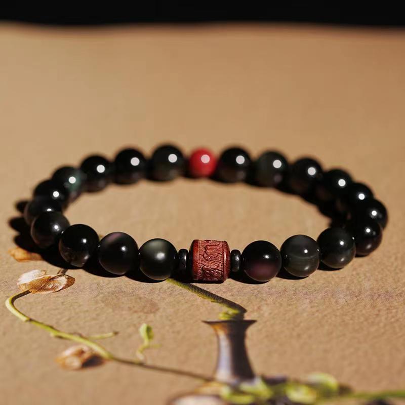 Gold Sheen & Rainbow Obsidian Fu Bracelet – styled with dried flowers and vase, artisan jewelry