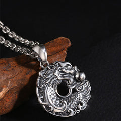 Koi Fish Dragon Pendant - angled view showing dual koi-dragon carving, luck amulet