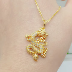 Gold Dragon Protection Necklace – Crystal-encrusted dragon pendant worn on chest, gold sparkle, Protection
