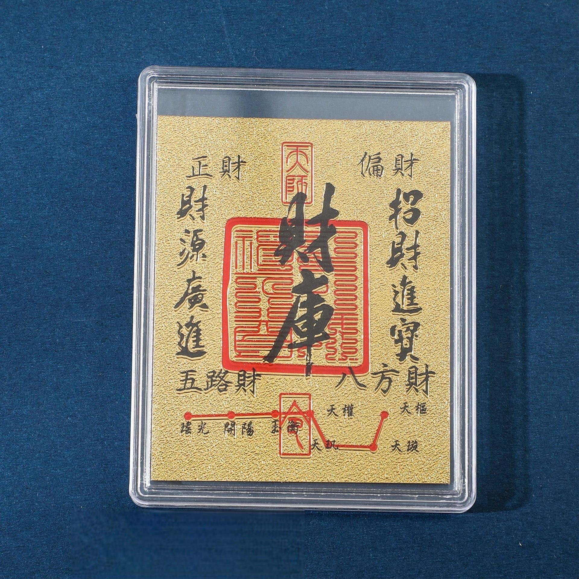 Gold Wealth Vault fortune sticker in clear display case on blue background