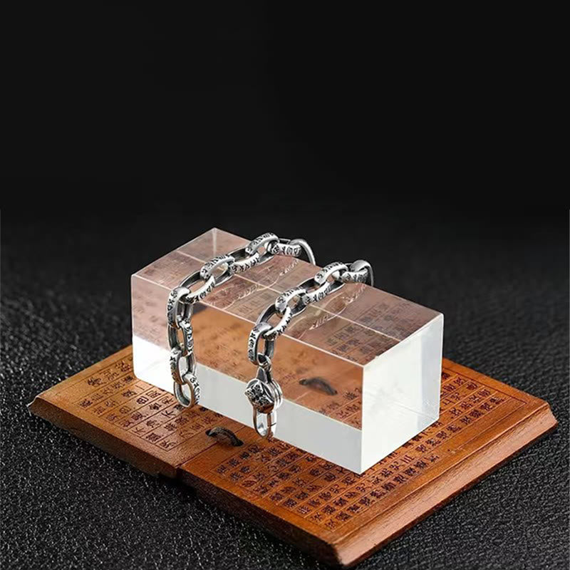 Double Dorje Wisdom Bracelet - Displayed on acrylic block over etched wood stand, dark background