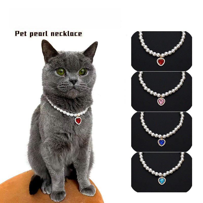 Crystal Heart Pet Necklace – Gray cat wearing red heart pendant with pink, blue and aqua variants shown