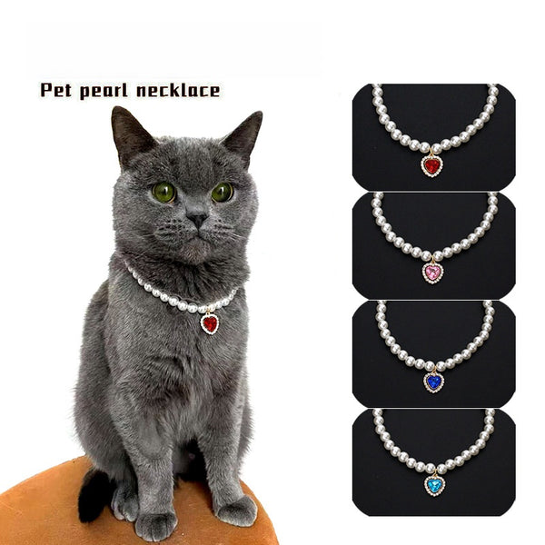 Crystal Heart Pet Necklace – Gray cat wearing red heart pendant with pink, blue and aqua variants shown