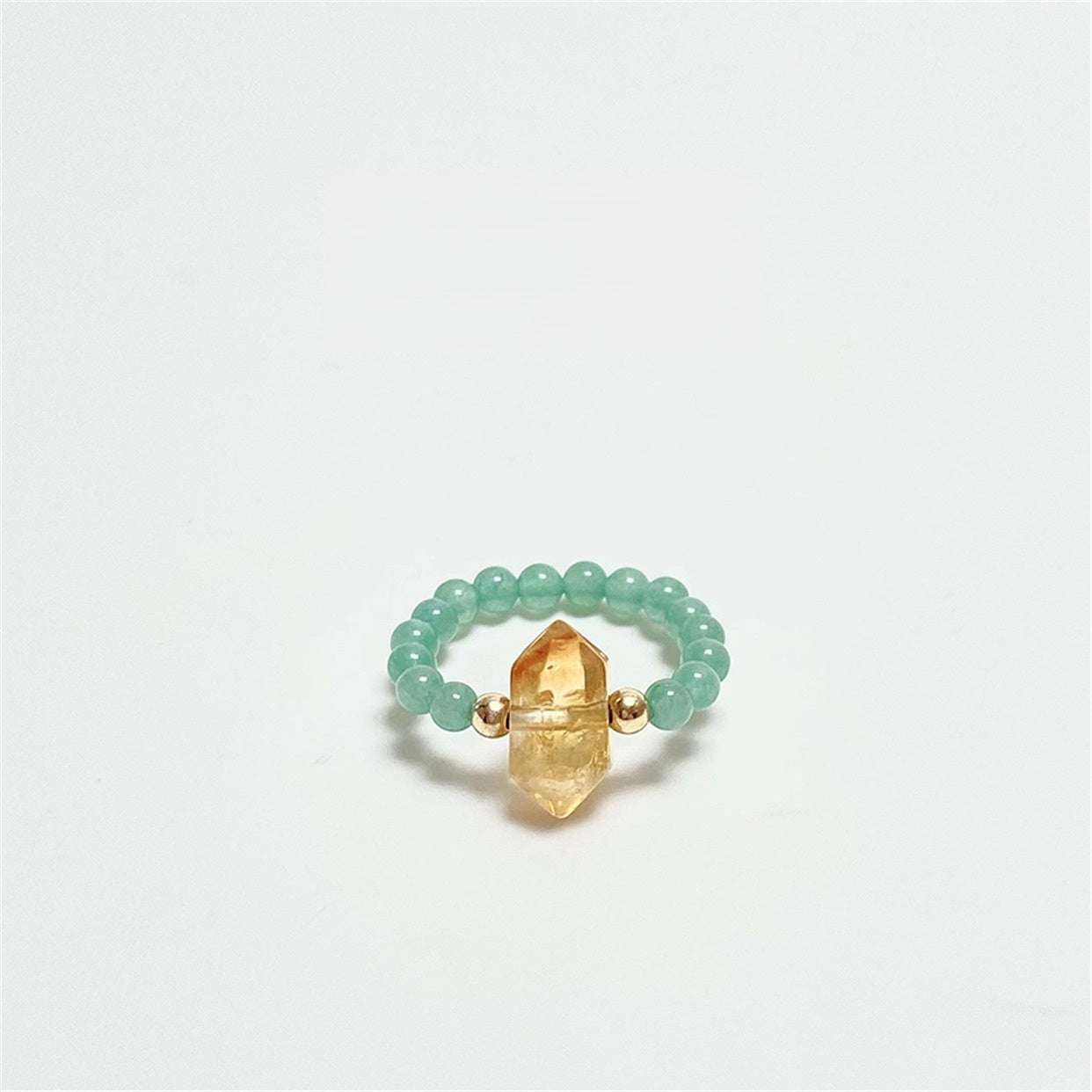 Citrine Aventurine Ring – Green aventurine bead ring with citrine double-point crystal on white background