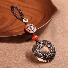 Pixiu Obsidian Keychain – obsidian pixiu disc on brown fabric with wooden tray, lucky car keychain