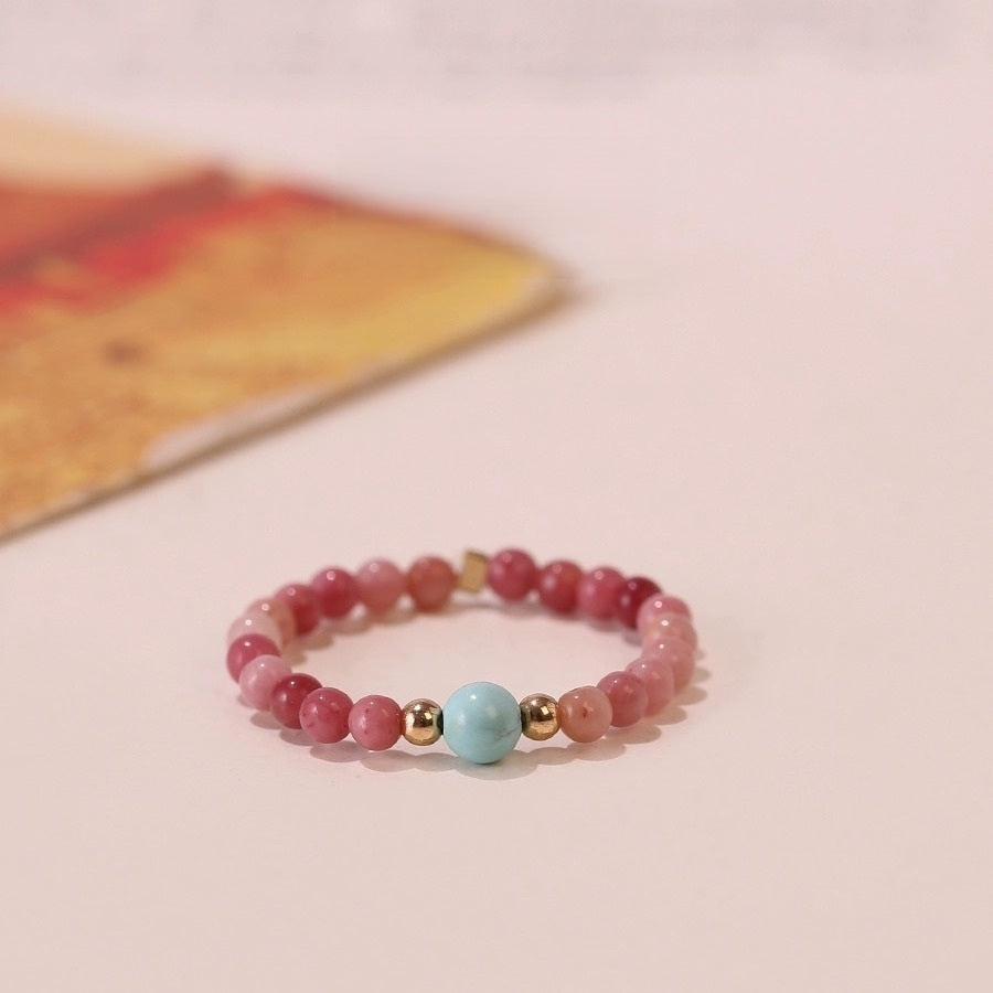 Gemstone Bead Ring – pink rhodochrosite beads with turquoise center and gold spacers, soft pink surface with book corner, crystal jewelry