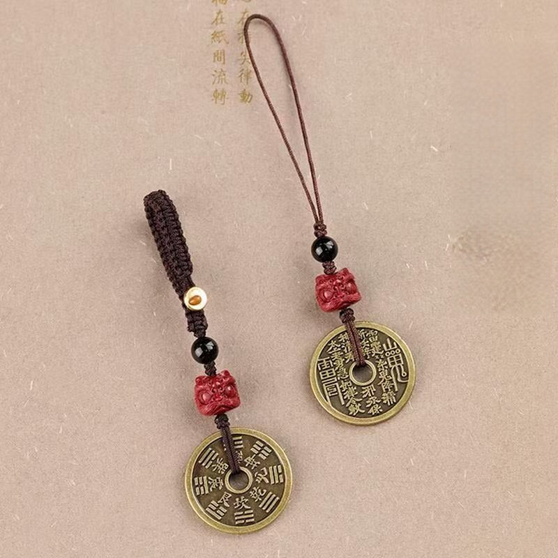 Cinnabar Bagua Mountain Ghost keychain and phone charm pair displayed together