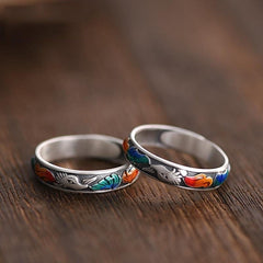 Enamel Fox Ring – Two vintage silver fox rings with rainbow enamel tails on dark wood, couple matching rings