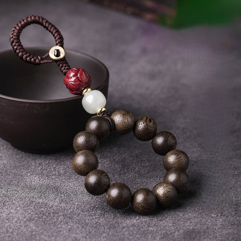 Agarwood & Hetian Jade Lotus Car Keychain, lifestyle shot, lucky charm