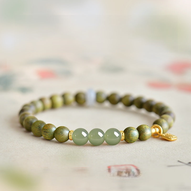 Green Sandalwood Bracelet – Single wrap with green jade on Chinese ink painting background, elegant zen