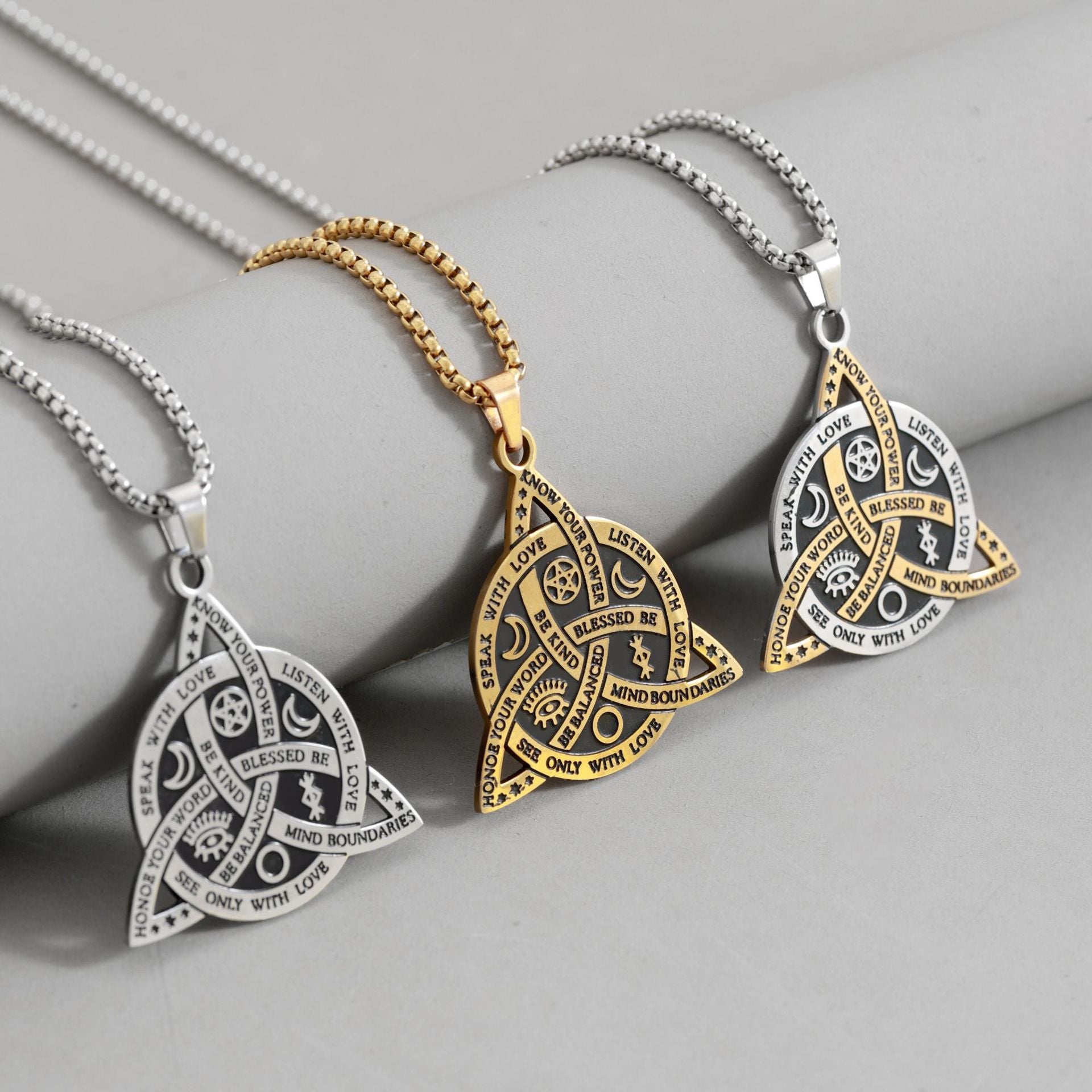 Celtic Moon Star Necklace – three pendants silver gold two-tone on gray display, necklace collection
