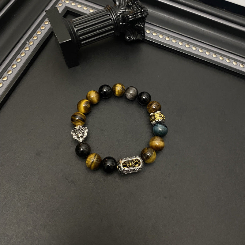 Tiger Eye Bracelet – Circular layout of tiger eye and obsidian beads with silver accents on black