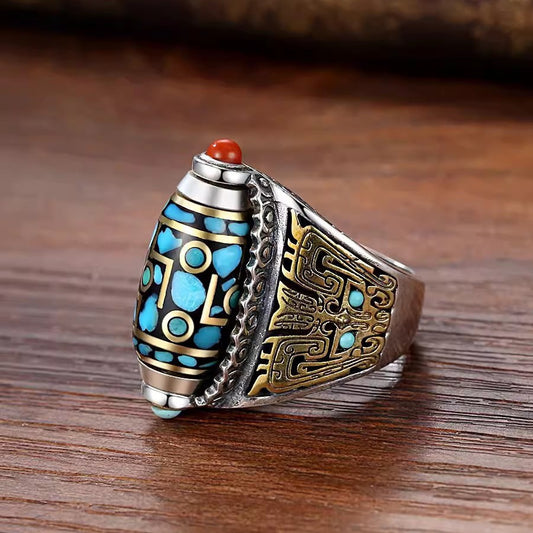 Dzi Bead Prayer Wheel Ring – silver band with blue nine-eye pattern and gold carving on wood