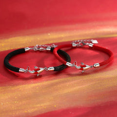 Koi Bracelets – couple set with black and red cords, silver koi charms on red gold background