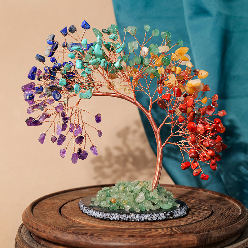 Chakra Crystal Tree – rainbow chakra tree on wooden base, teal curtain background, copper wire, vibrant home ornament