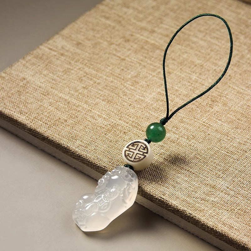 Chalcedony Pixiu Keychain – pixiu pendant on natural linen fabric with green cord and beads
