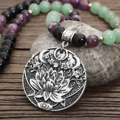 Amethyst Aventurine Lotus Mala - Necklace with lotus flower medallion on gray river stone, artisan mala