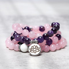 Rose Quartz Amethyst Mala Bracelet – closeup of pink and purple beads with silver lotus charm, front closeup