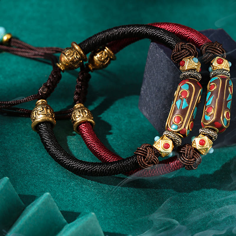 Tibetan Turquoise Om Mani Padme Hum Braided Bracelet – Red and black cord pair on green velvet with crystal accents