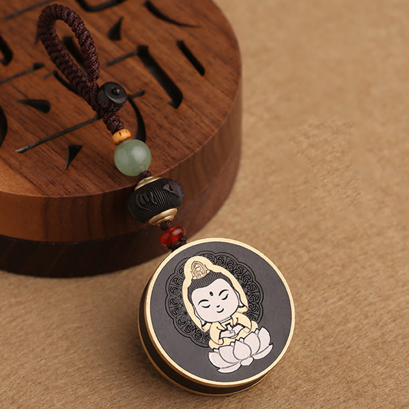Ebony Avalokitesvara Keychain – held between fingers showing pocket-sized scale, everyday carry Buddha