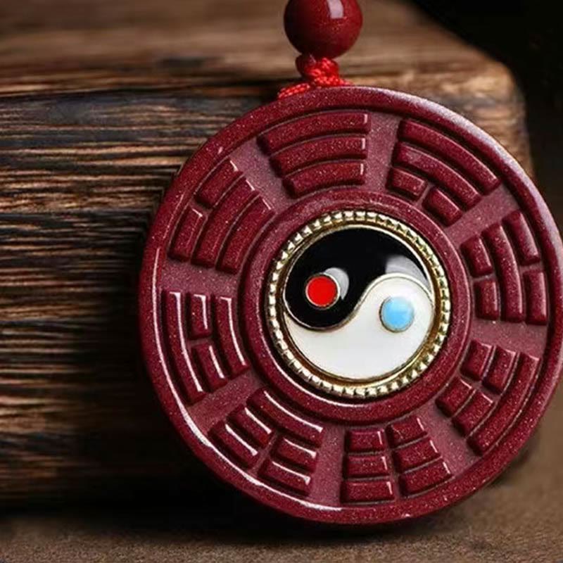 Cinnabar Bagua Rotatable Yin Yang Necklace – Carved cinnabar Bagua Yin-Yang pendant on wooden prop, Chinese spiritual jewelry