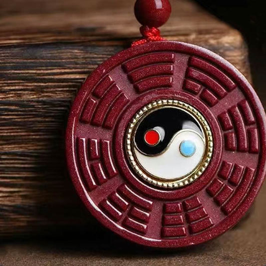 Cinnabar Bagua Rotatable Yin Yang Necklace – Carved cinnabar Bagua Yin-Yang pendant on wooden prop, Chinese spiritual jewelry