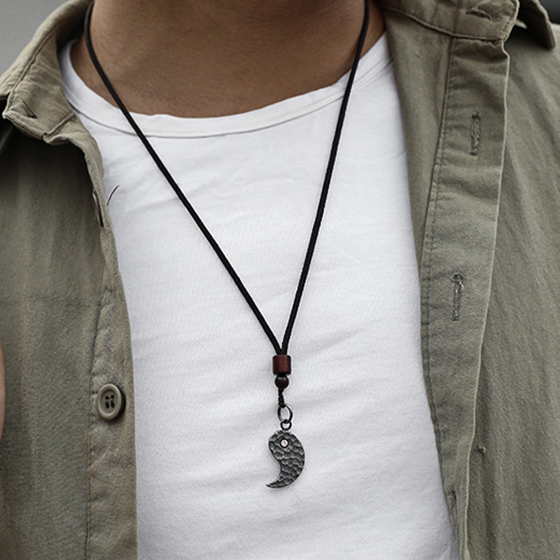 Sterling Silver Yin Yang Pendant - Dark hammered pendant necklace worn on model with casual shirt, men spiritual jewelry