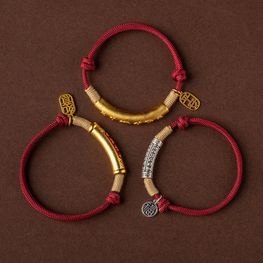 Set of three adjustable burgundy cord bracelets with gold and silver tube beads, Chinese fortune happiness and peace character charms on brown fabric