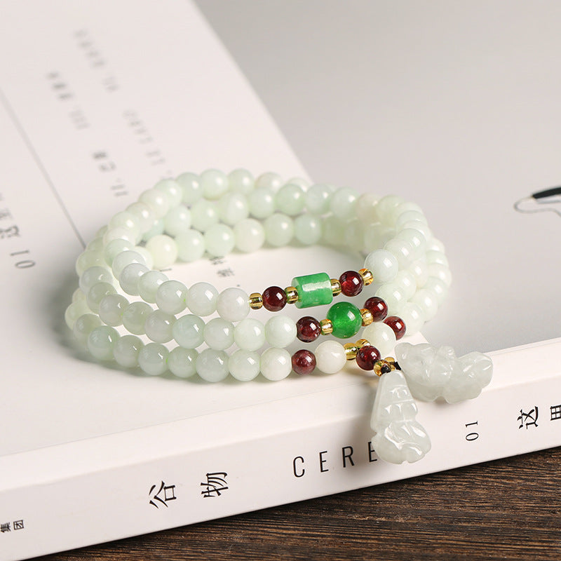 Jade Pixiu Maitreya Buddha Abundance Bracelet – On white book with jade PiXiu pendant, feng shui jewelry