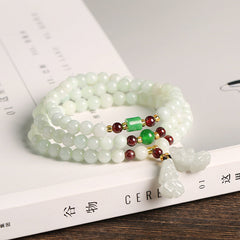 Jade Pixiu Maitreya Buddha Abundance Bracelet – On white book with jade PiXiu pendant, feng shui jewelry