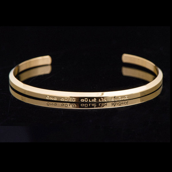 Om Mani Padme Hum Engraved Bracelet – gold cuff at three-quarter angle showing engraving, blessing bracelet