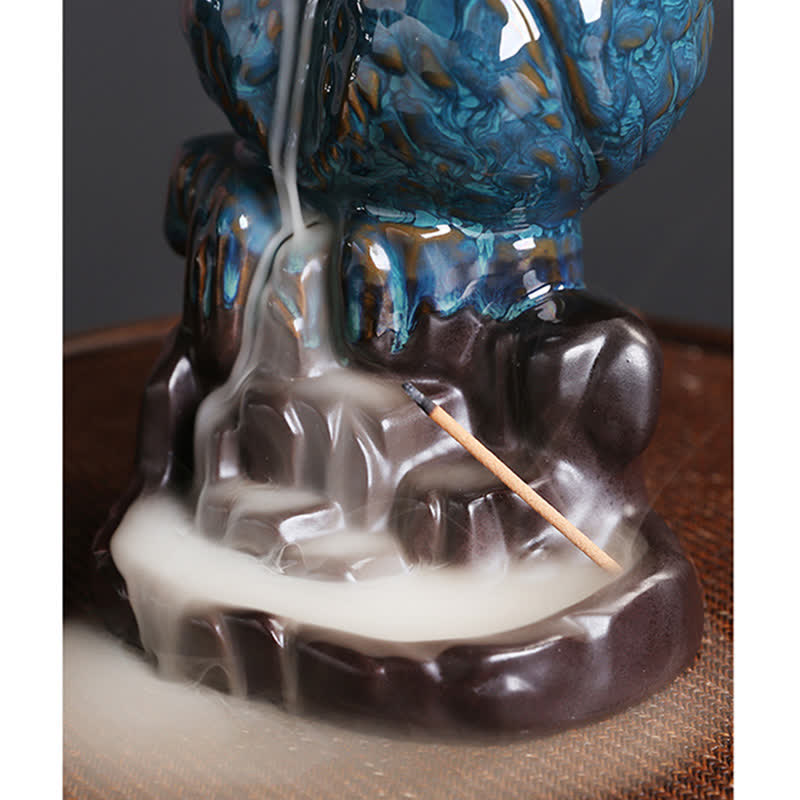 Owl Backflow Incense Burner - smoke waterfall over teal glazed rocks, serene