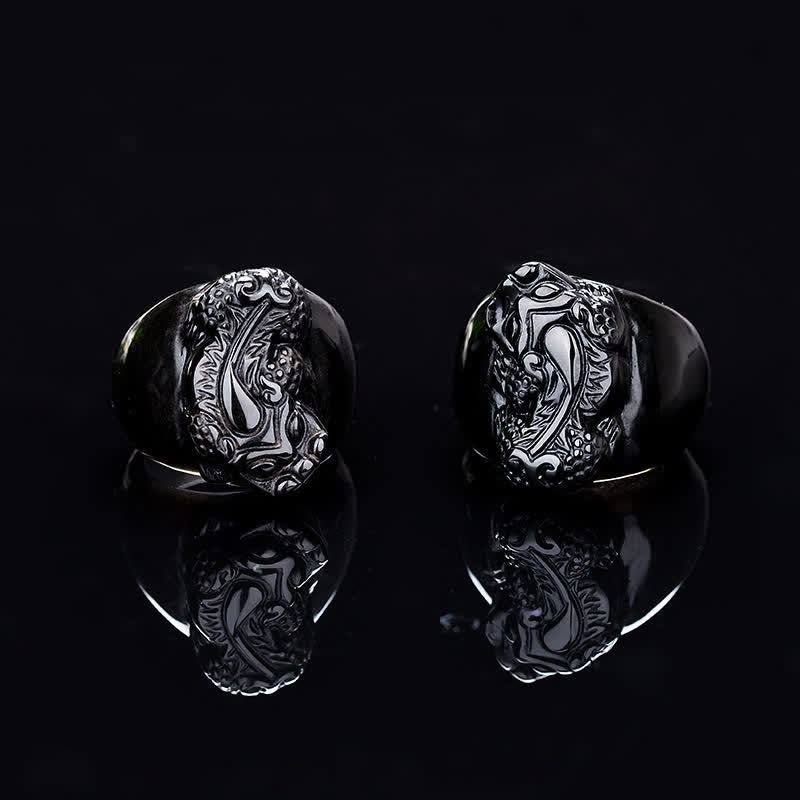FengShui PiXiu Strength Ring – Two silver-tone pixiu motif rings on black reflective surface, gothic ring