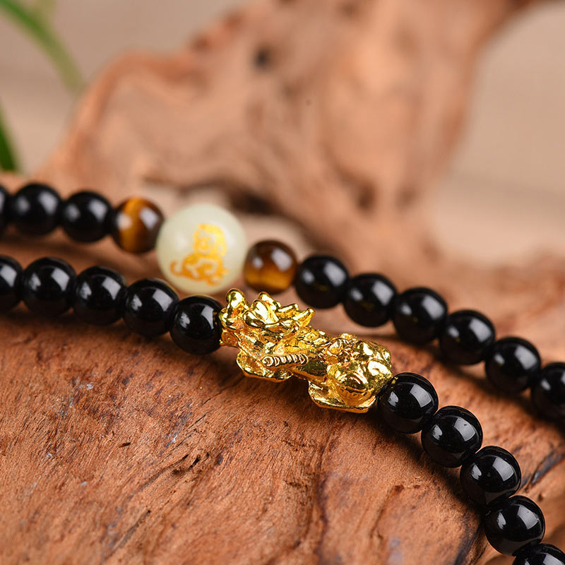 Zodiac Obsidian PiXiu Mala – Macro gold PiXiu on black obsidian and tiger eye beads