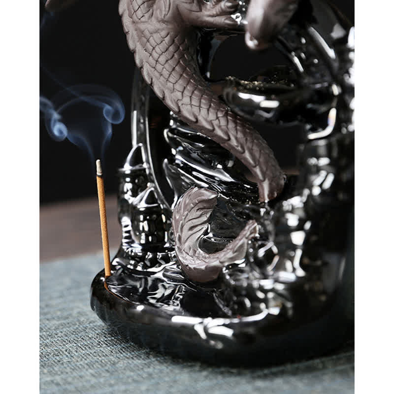 Ceramic Dragon Incense Burner – lit incense stick on black base with dragon scales, serene