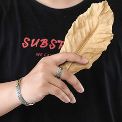 Natal Buddha Ring - Worn ring and matching bracelet holding dried leaf, Blessed