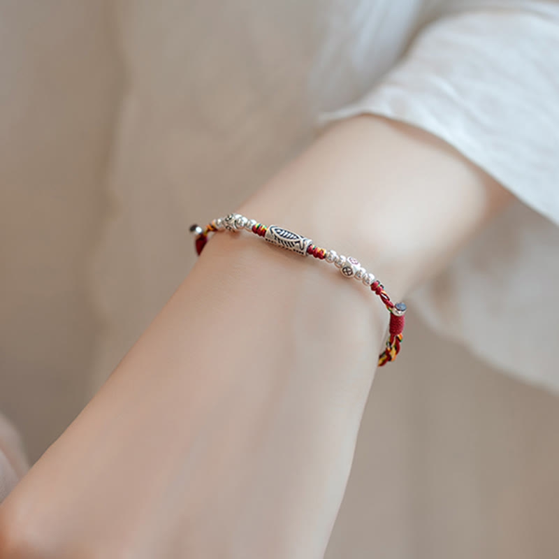 925 Koi Braided Bracelet - vibrant red and blue braided thread texture close-up, luck