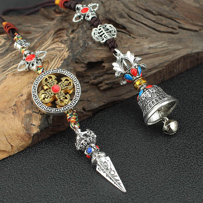 Tibetan Vajra Dorje Car Hanging – Vajra medallion and ritual bell pair on weathered wood, spiritual pendant