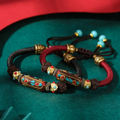 Tibetan Turquoise Om Mani Padme Hum Braided Bracelet – Two cord colors on green velvet with turquoise inlay focal beads