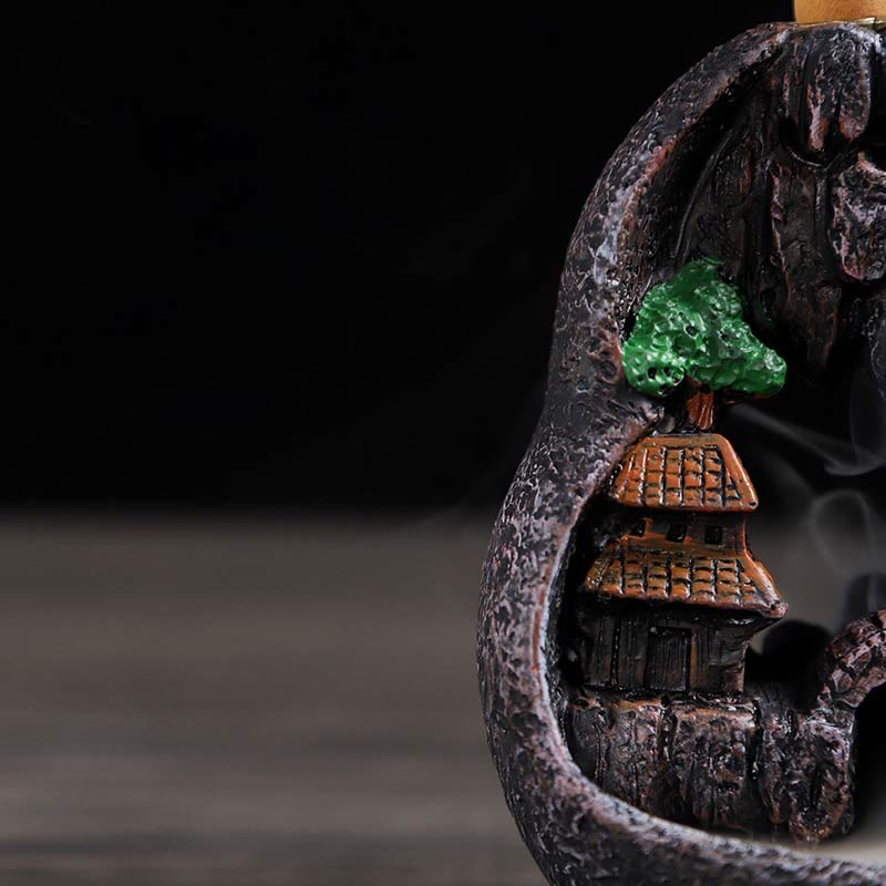 Resin Backflow Incense Burner – Interior carved grotto with tiered pagoda, green tree and curling smoke, meditation
