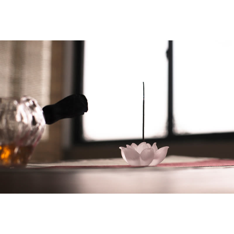 Lotus Liuli Incense Burner – backlit by window with amber bottle, Airy