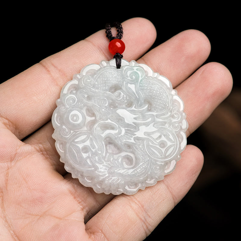 White Jade Dragon Necklace – Round jade pendant with dragon and coin motifs on open palm, Prosperous