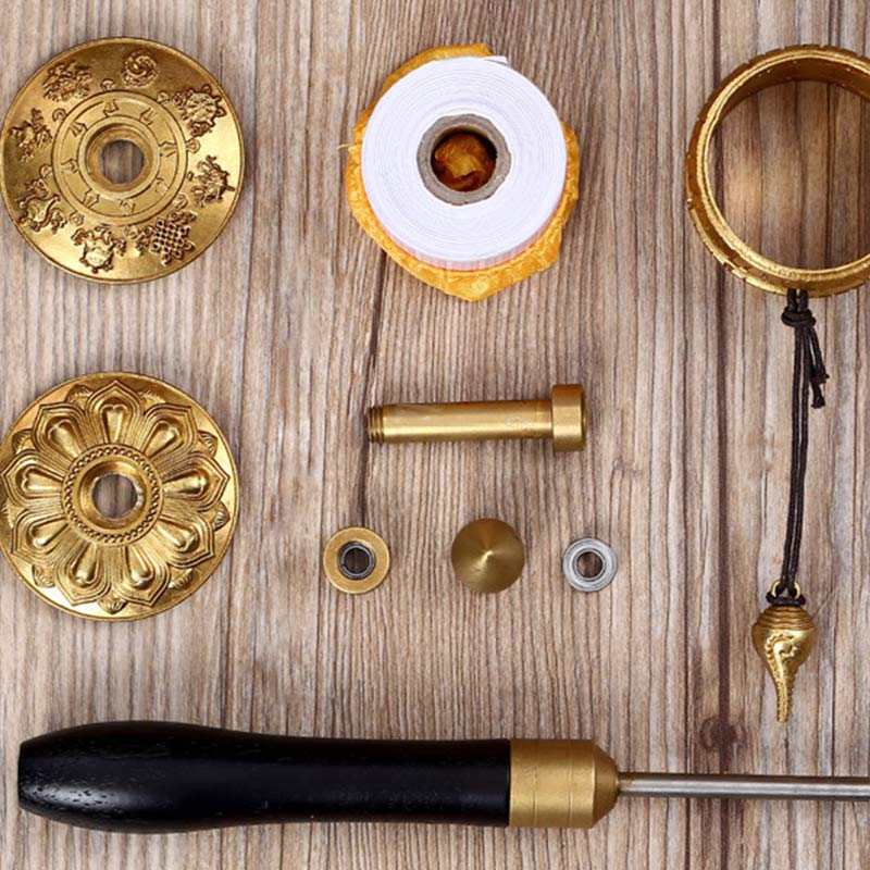 Copper Meditation Prayer Wheel – Disassembled parts flat lay with mantra discs and scroll