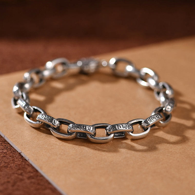Om Mani Padme Hum Silver Bracelet – Close-up of alternating oval and bar links with Tibetan script engravings, oxidized finish