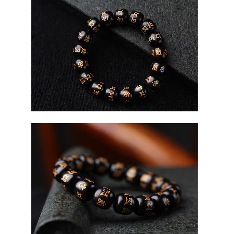 Ebony Wood Om Mani Padme Hum Bracelet – Two-angle view on dark fabric and stone surface, Buddhist beads
