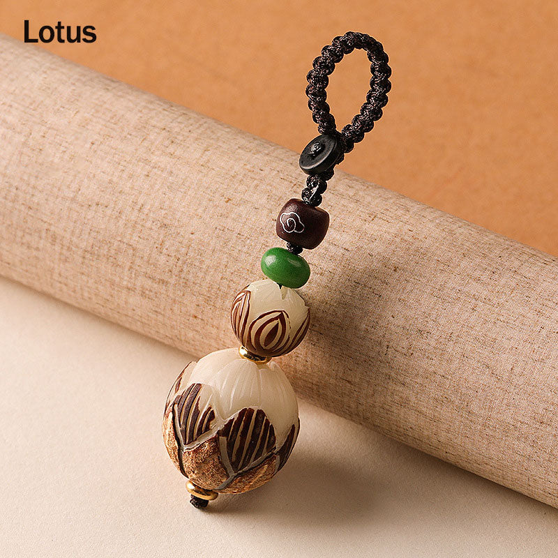 Bodhi Seed Blessing Keychain - stacked carved lotus flowers blooming from bodhi seed with jade bead on woven cord, purity
