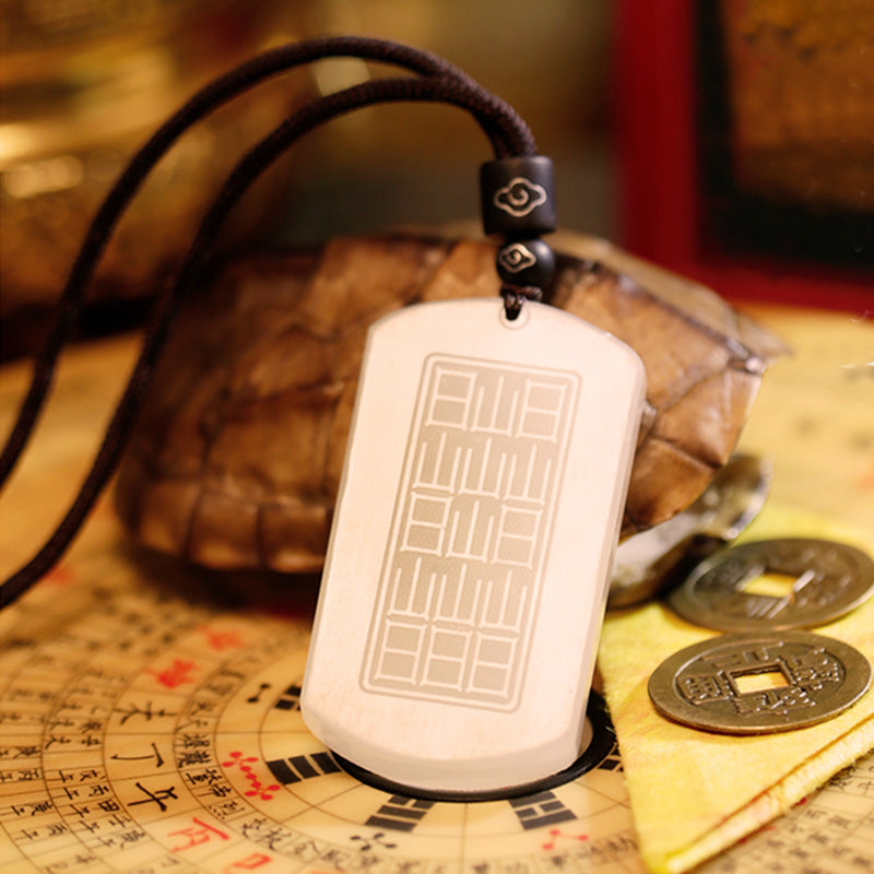 White Jade PiXiu Pendant – Reverse side of white jade pendant with bagua on tortoise shell and coins
