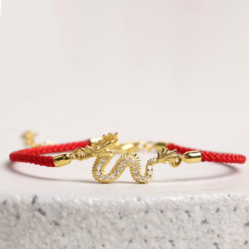 925 Silver Dragon Bracelet - Red cord dragon hovering over gray granite, minimalist luxury