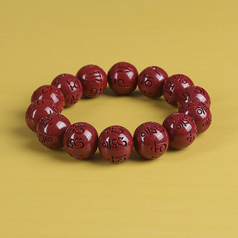 Double PiXiu Cinnabar Bracelet – Polished cinnabar mantra beads arranged in circle on yellow, healing bracelet