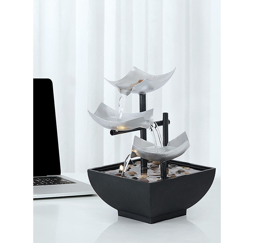 Three Layers Lotus Waterfall Fountain - Silver tiers beside laptop on white desk, Peaceful